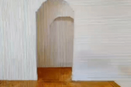 A pixelized photo of a balloon in an empty room